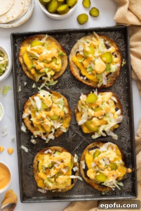 MacSmash Taco 16 Big Mac Smash burger tacos arranged on a sheet pan, ready to be served.