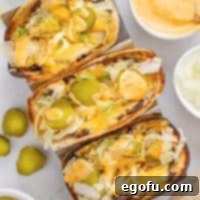 MacSmash Taco 10 Looking down on three Big Mac Smashburger Tacos, artfully arranged on a serving plate.