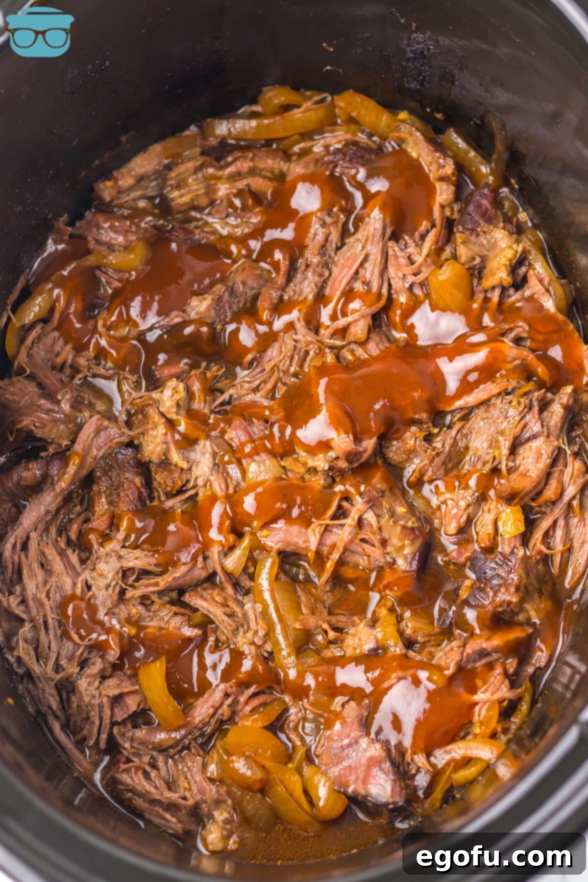 Tender Dr Pepper Slow Cooker Pulled Beef 2 A full Crockpot with Dr Pepper Shredded Beef, ready to be served.