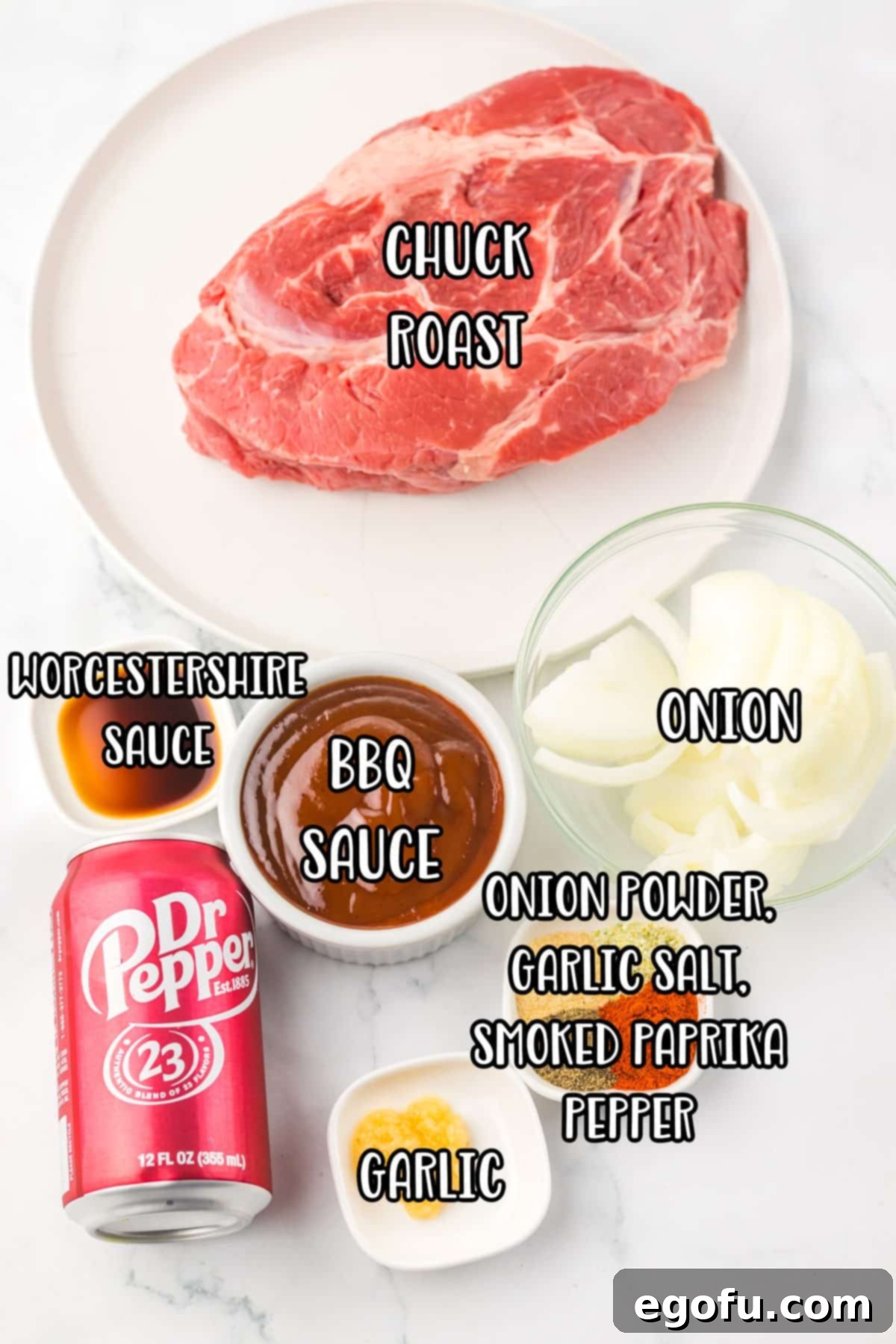 Tender Dr Pepper Slow Cooker Pulled Beef 3 A collection of ingredients for Dr Pepper Shredded Beef: onion, chuck roast, onion powder, bbq sauce, Dr Pepper can, Worcestershire sauce, garlic salt, smoked paprika, pepper, and garlic.