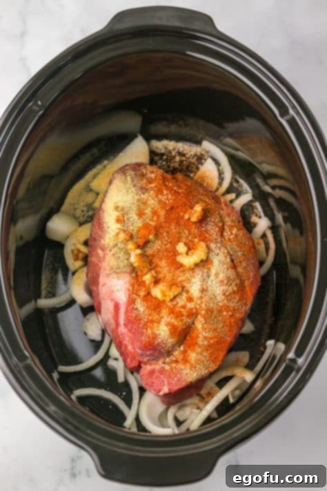 Tender Dr Pepper Slow Cooker Pulled Beef 8 Seasoned beef in a crockpot.