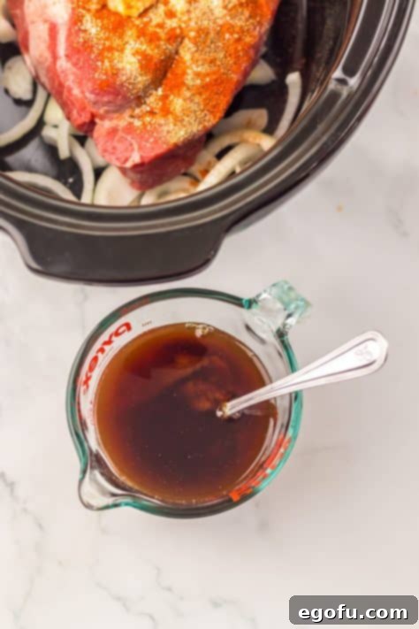 Tender Dr Pepper Slow Cooker Pulled Beef 9 A bowl with Worcestershire sauce, Dr. Pepper and bbq sauce.