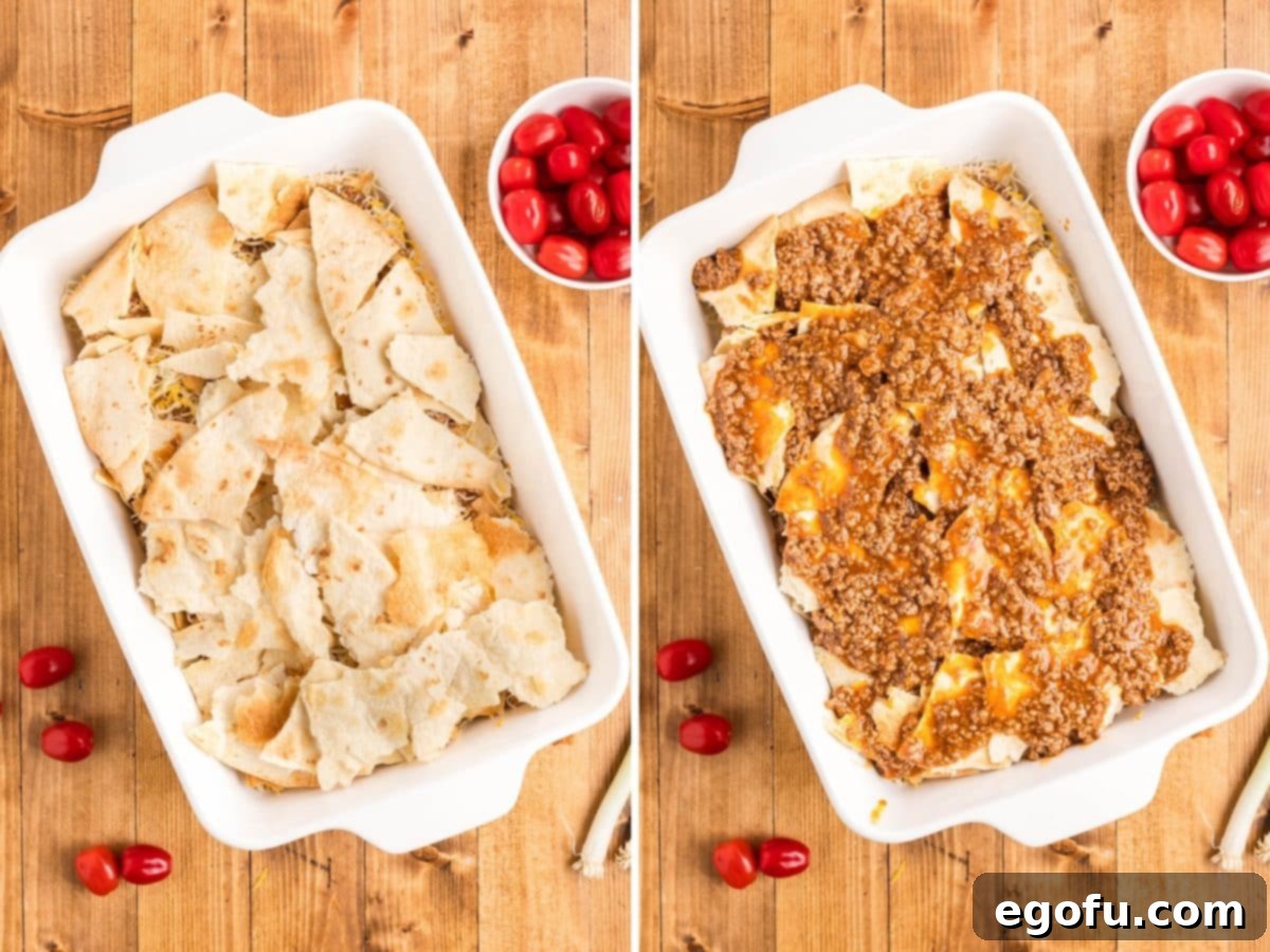 The second set of layers being assembled: broken shells, followed by the remaining meat mixture, creating a full casserole.