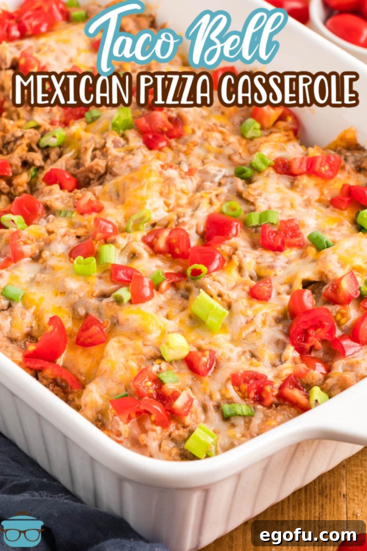 A large baking dish filled with a golden brown Taco Bell Mexican Pizza Casserole, ready to be served.