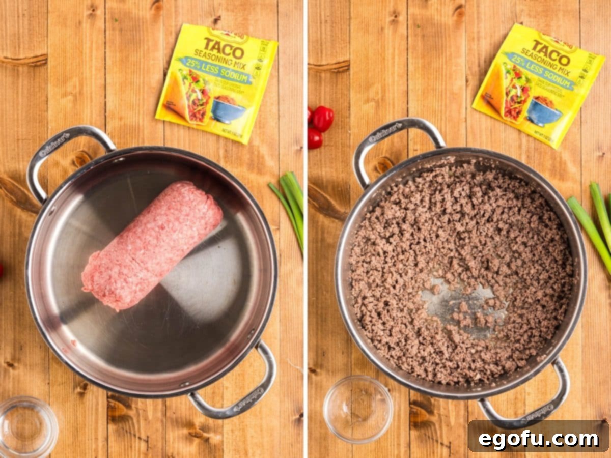 Ground beef being browned and crumbled in a skillet, preparing the savory filling for the casserole.