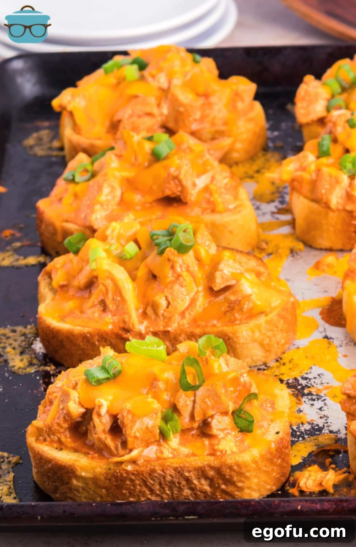 A few pieces Buffalo Chicken Garlic Texas Toast lined on a baking sheet.