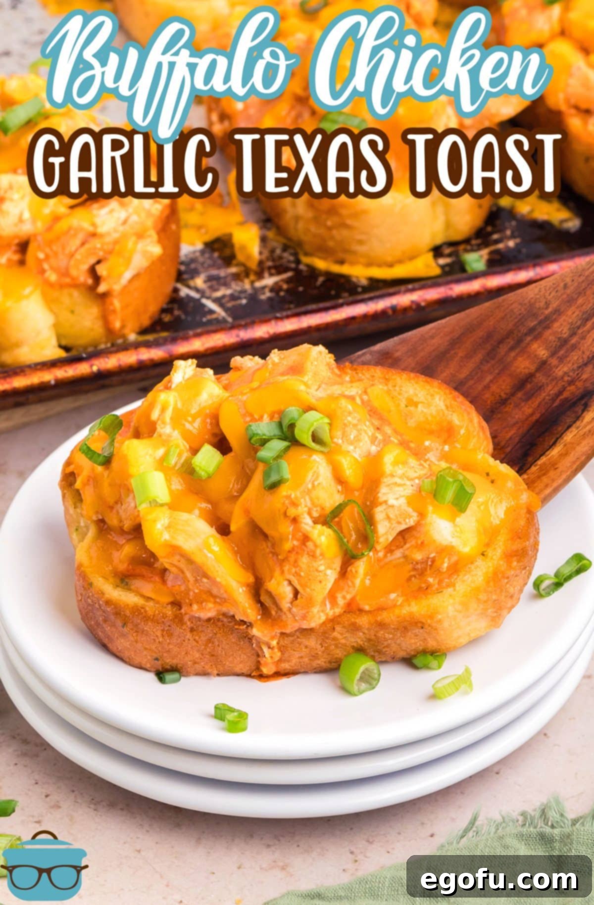 A wooden serving utensil dropping a slice of Buffalo Chicken Garlic Texas Toast.