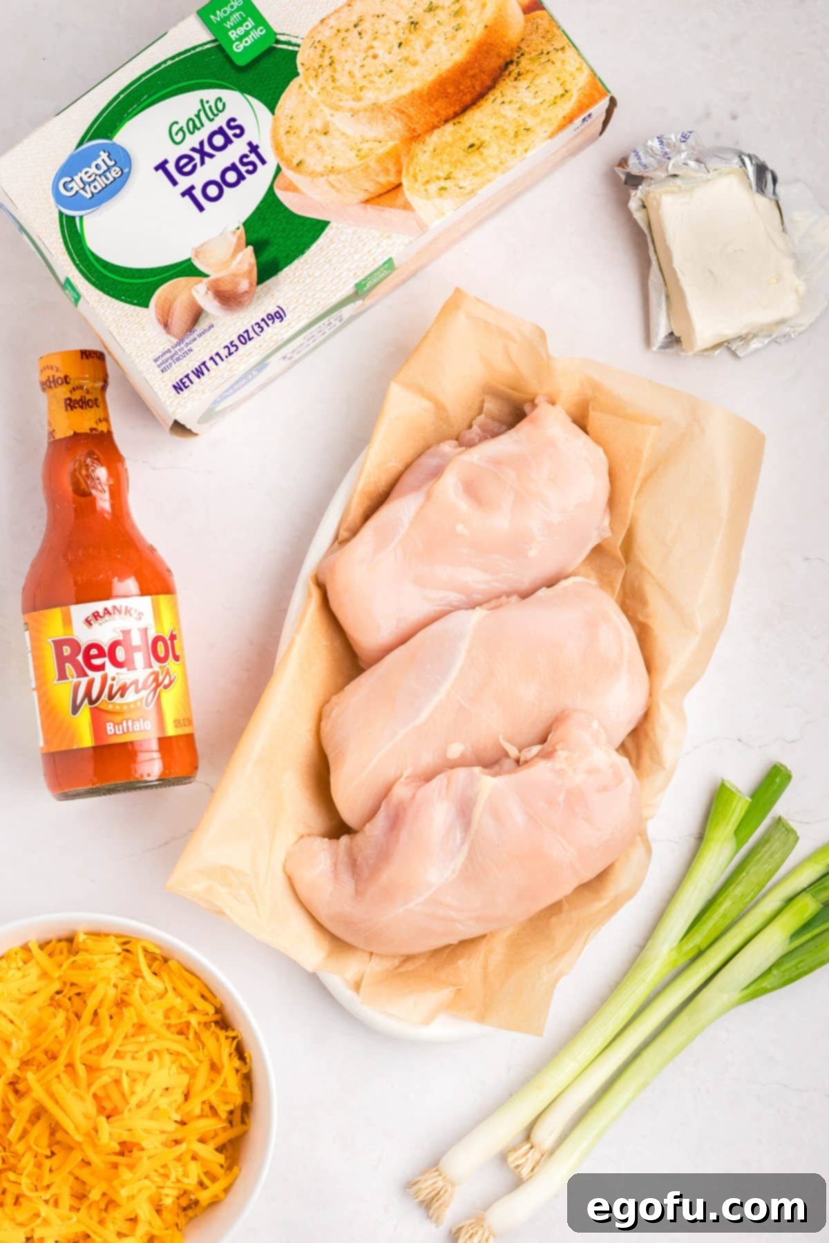 Chicken breasts, Red Hot Sauce, green onions, Texas Toast, cheese, and cream cheese.