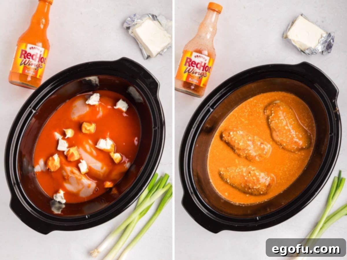 A Crock Pot with hot sauce, cream cheese, and chicken.