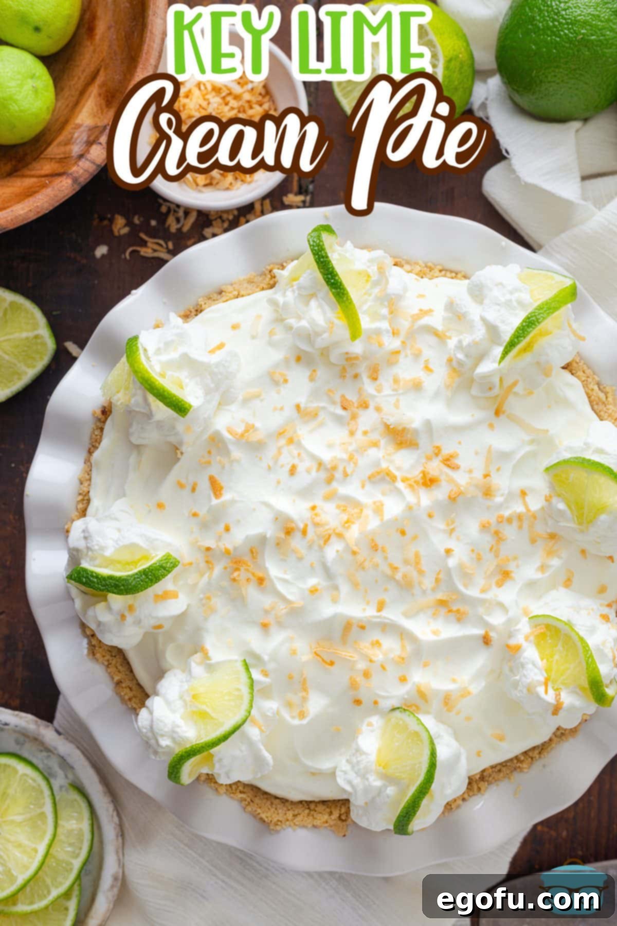 A beautifully garnished Key Lime Cream pie, sliced and ready to serve.