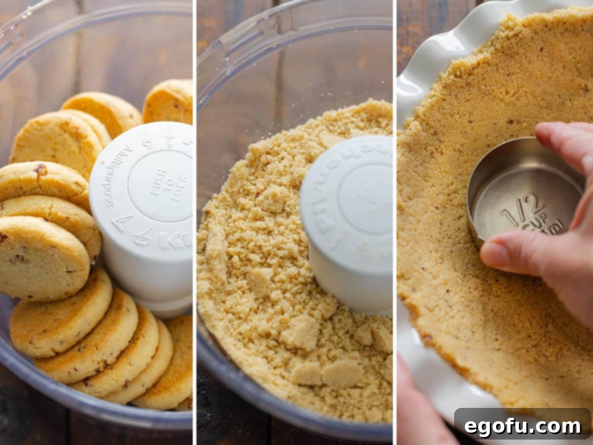 Cookies being pulsed in a food processor with melted butter to make a cookie crumb crust.