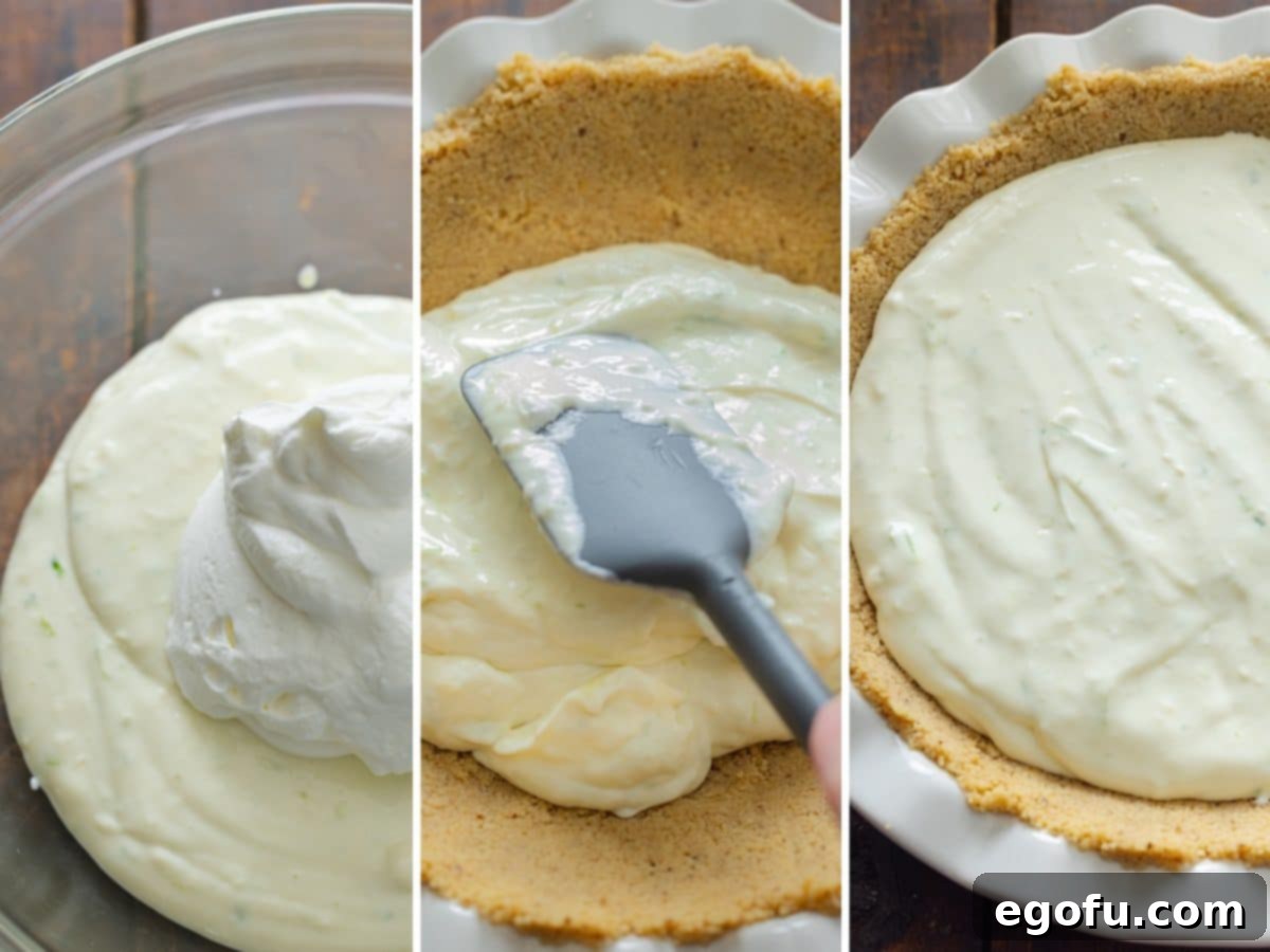 Whipped cream mixture being gently folded into the Key lime filling and then poured into the prepared pie crust.