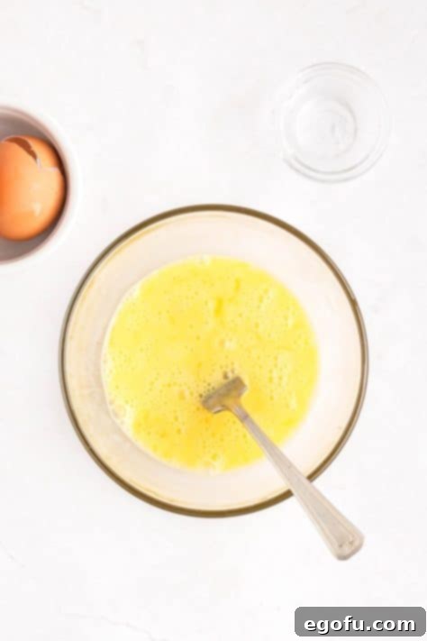 A bowl with an egg wash.