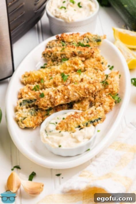 A plate full of Air Fryer Zucchini Fries.