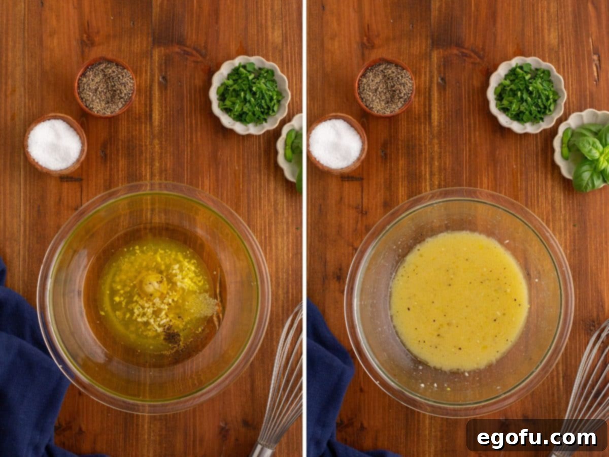 A bowl with fresh lemon juice, white wine vinegar, Dijon mustard, garlic, salt, and pepper being whisked together to form the vibrant salad dressing.