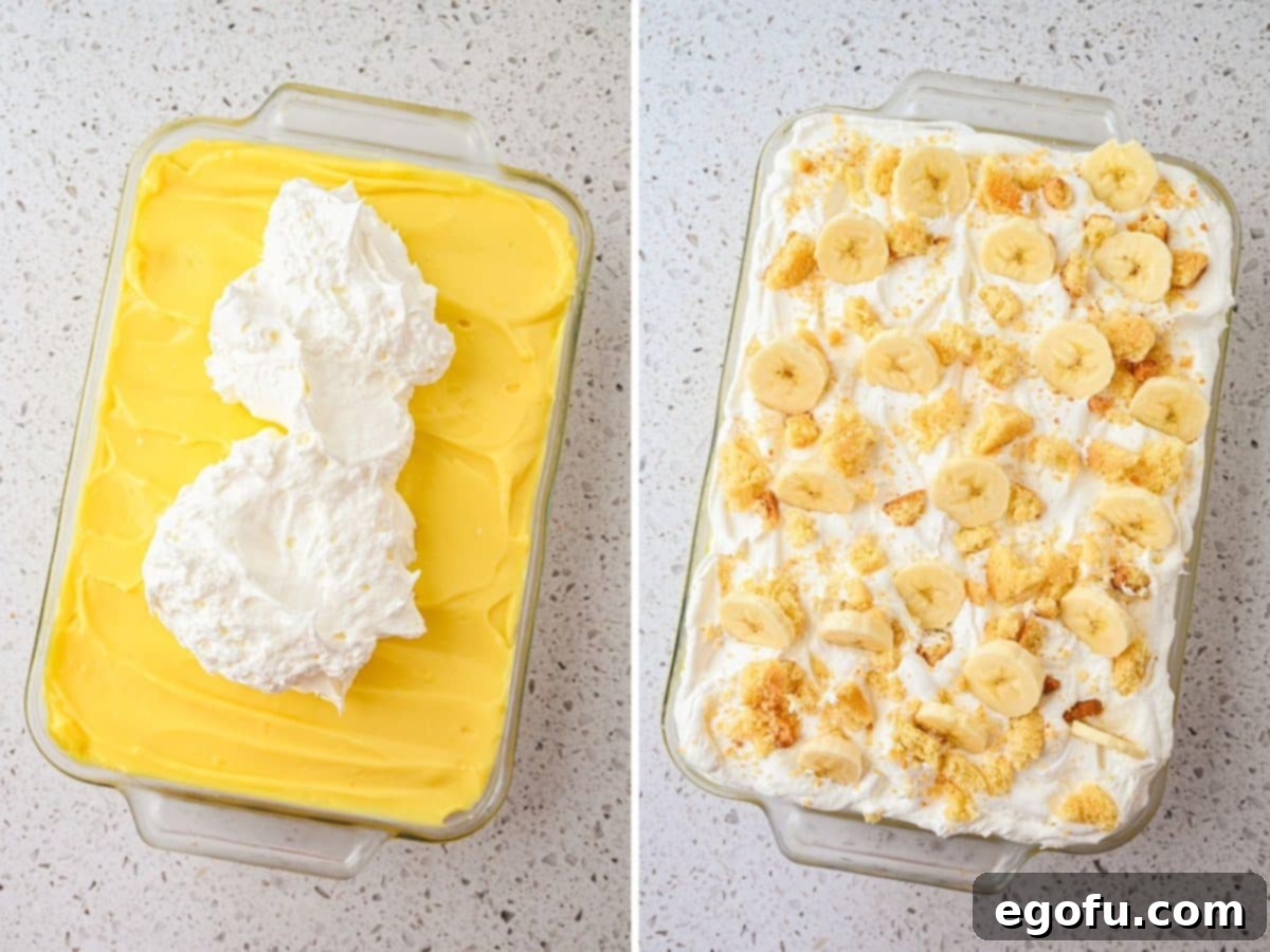 Whipped topping being gently spread over the banana pudding layer, preparing for final garnishes.