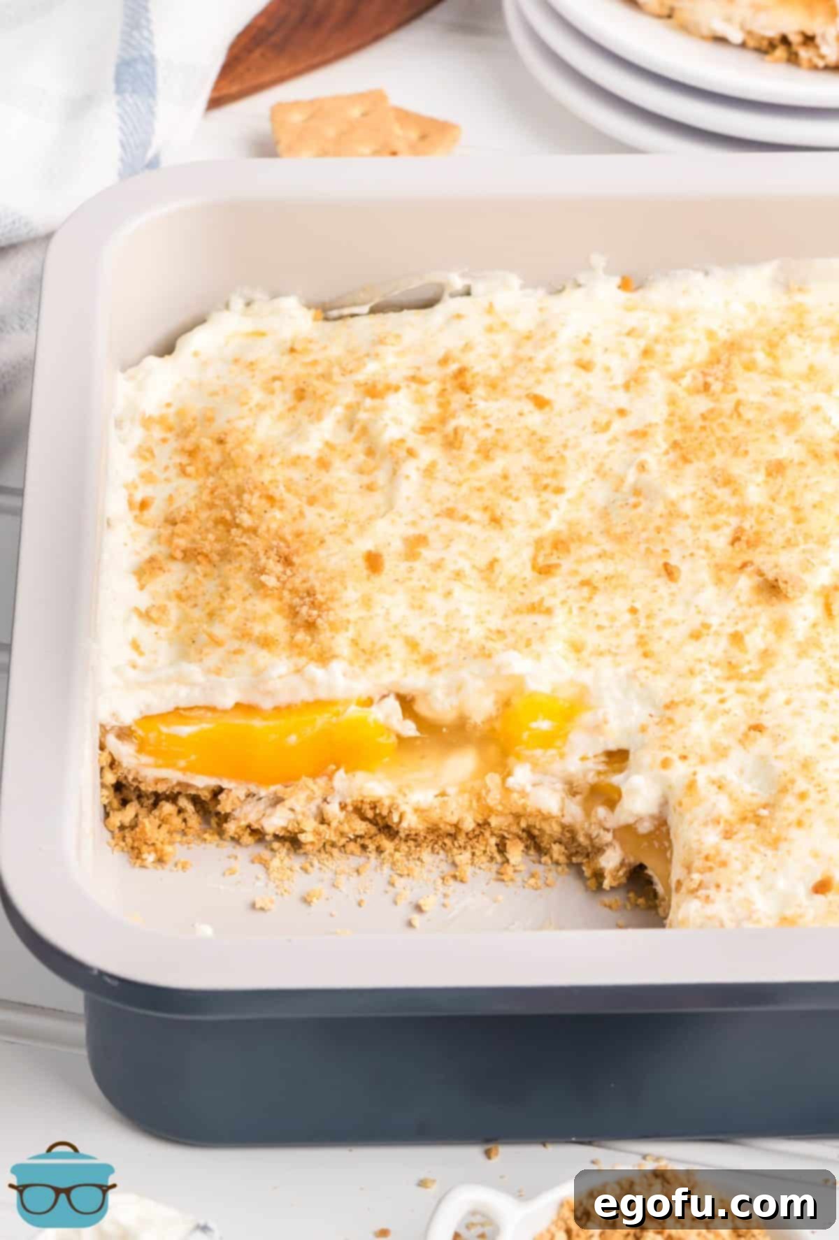 A baking dish with Peach Yum Yum and a slice removed.