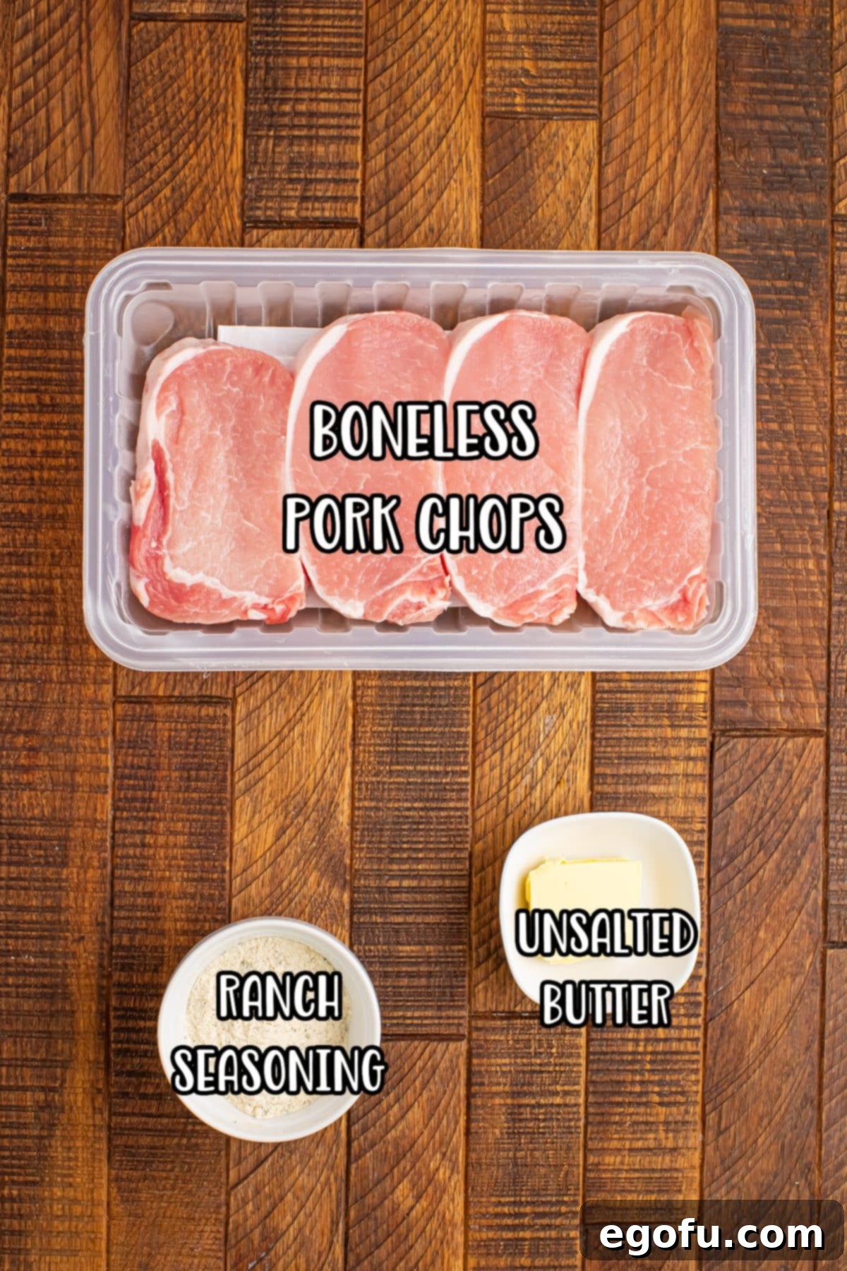 Golden Ranch Butter Pork Chops 4 Boneless pork chops, ranch seasoning, and unsalted butter laid out on a counter.