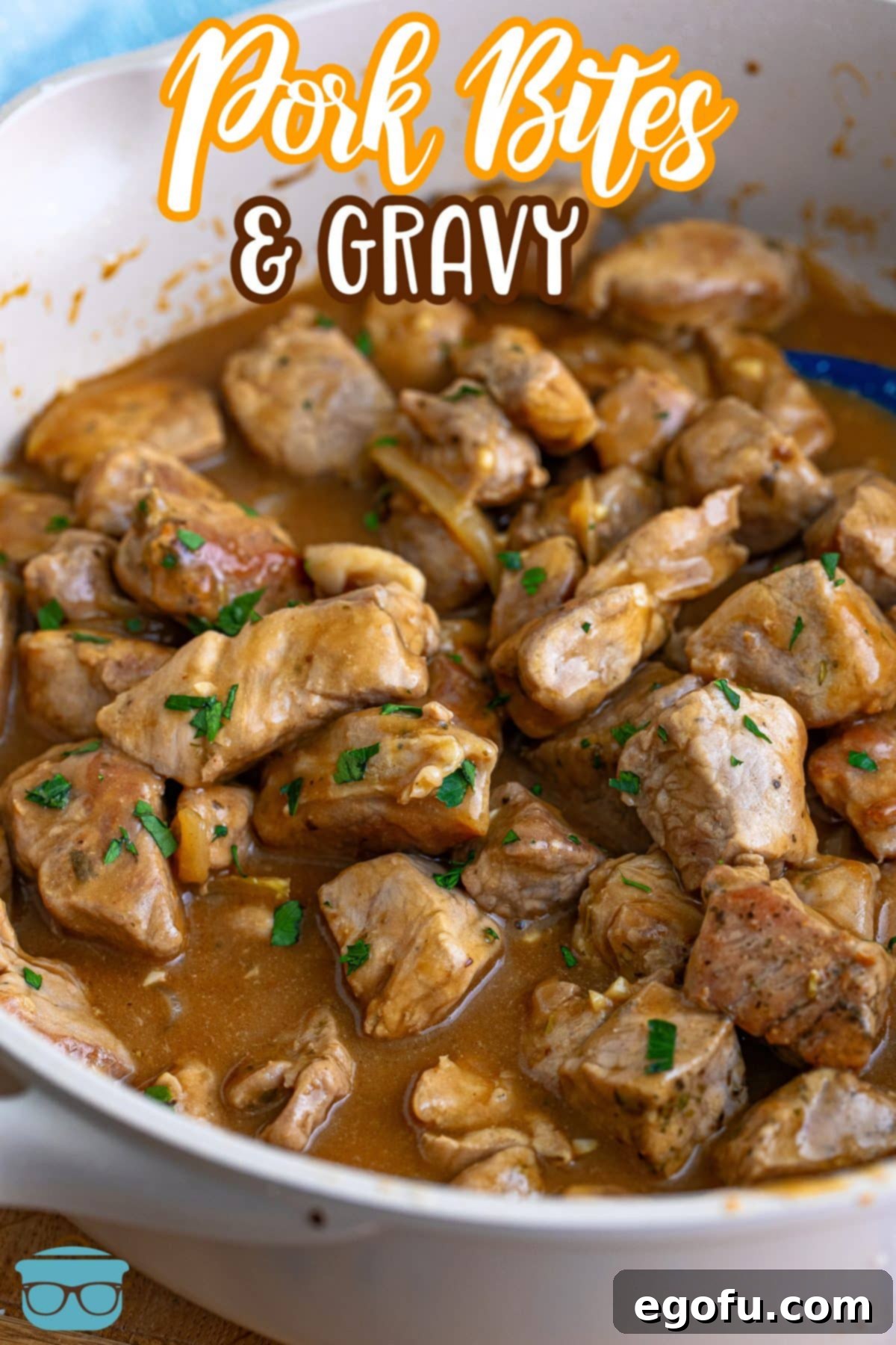 Tender Pork Bites in Rich Gravy 3 A serving bowl full of rich, homemade gravy and tender pork bites, ready to be enjoyed.