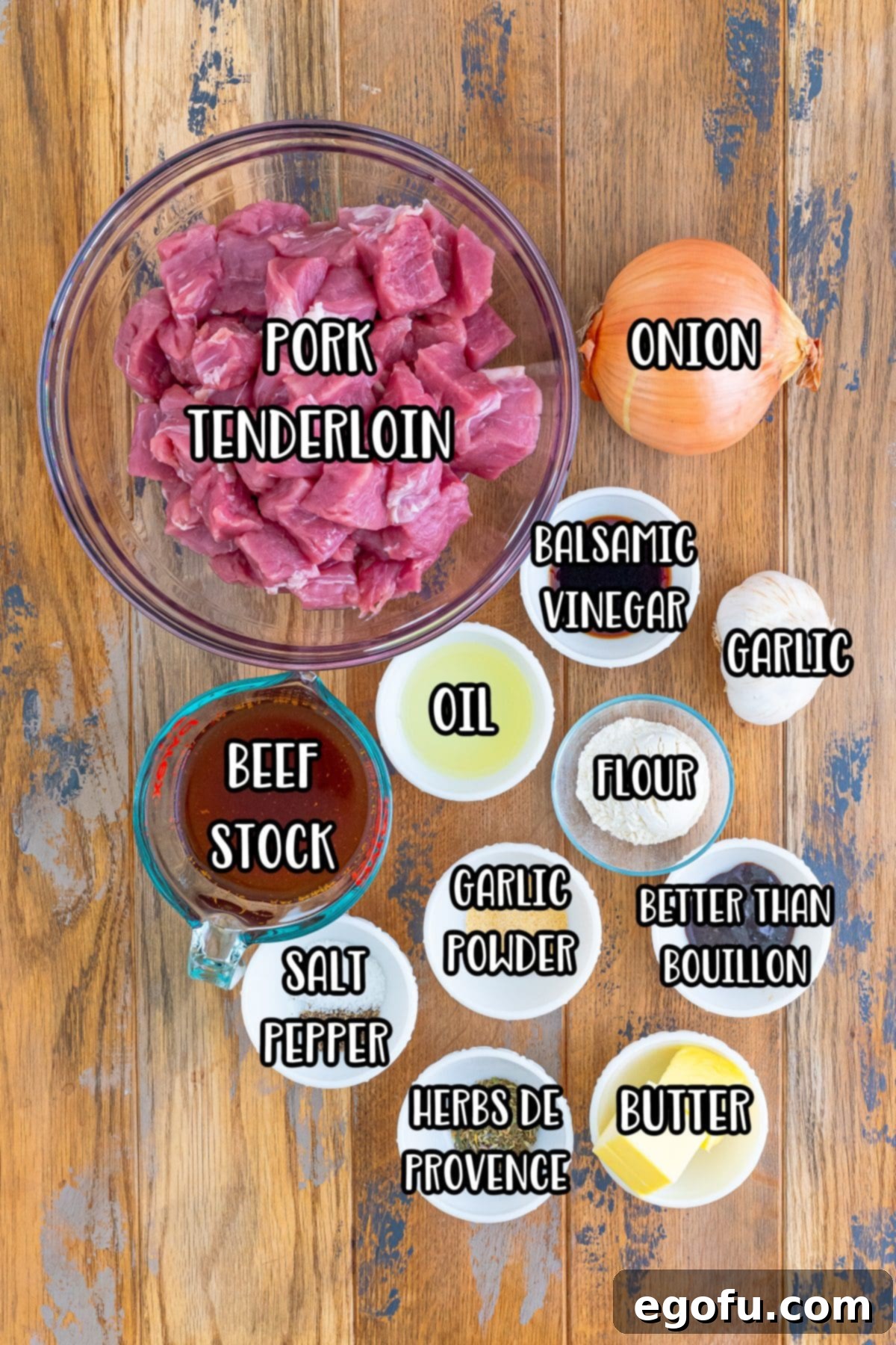 Tender Pork Bites in Rich Gravy 4 A display of all the fresh ingredients needed for Pork Bites with Gravy: pork tenderloin, onion, oil, beef stock, balsamic vinegar, garlic powder, salt, pepper, Herbs de Provence, butter, minced garlic cloves, and Better Than Bouillon.