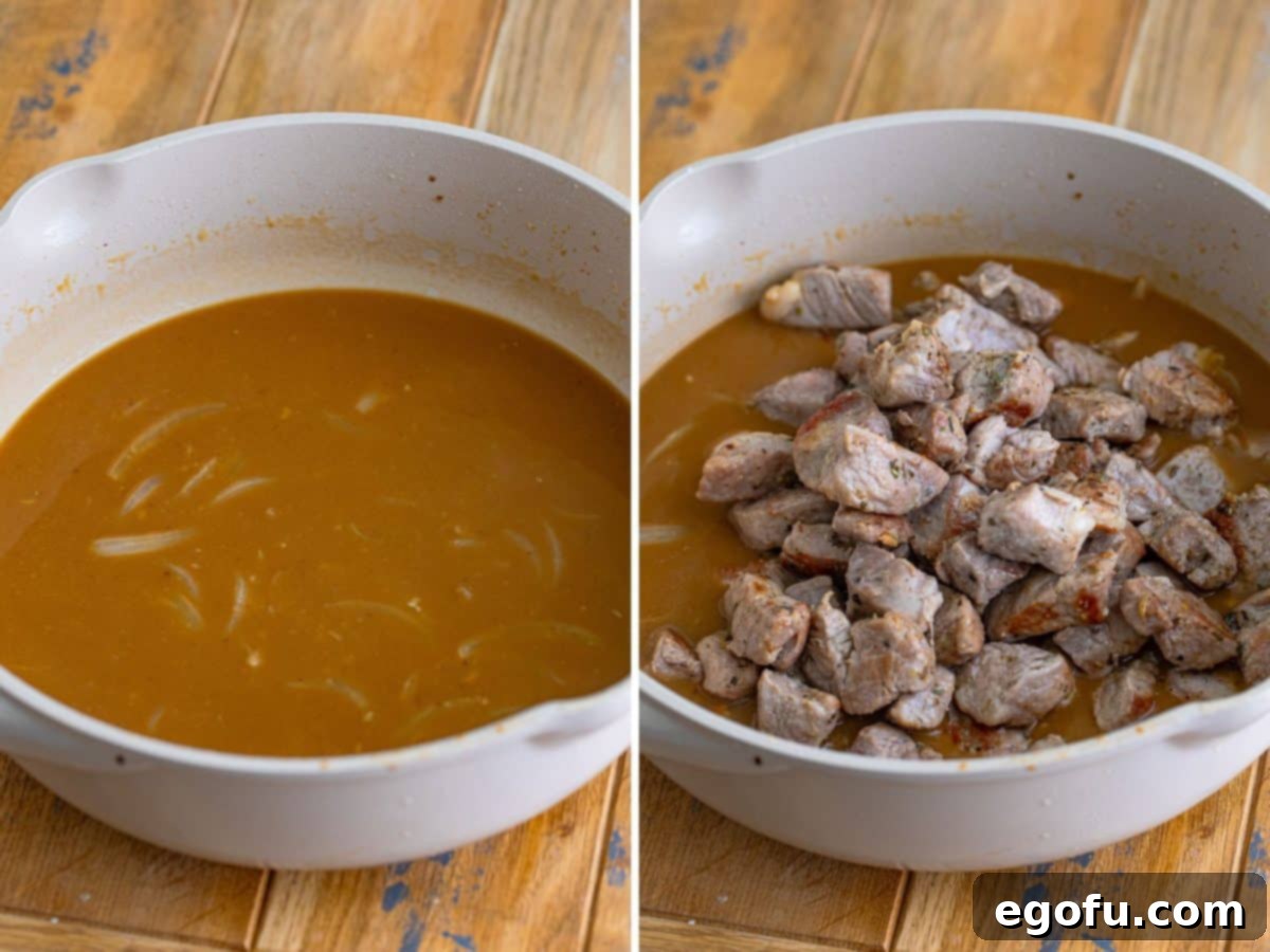Tender Pork Bites in Rich Gravy 7 Beef broth being slowly added to a skillet containing the aromatic onion, garlic, butter, and flour mixture, beginning to form the rich gravy.