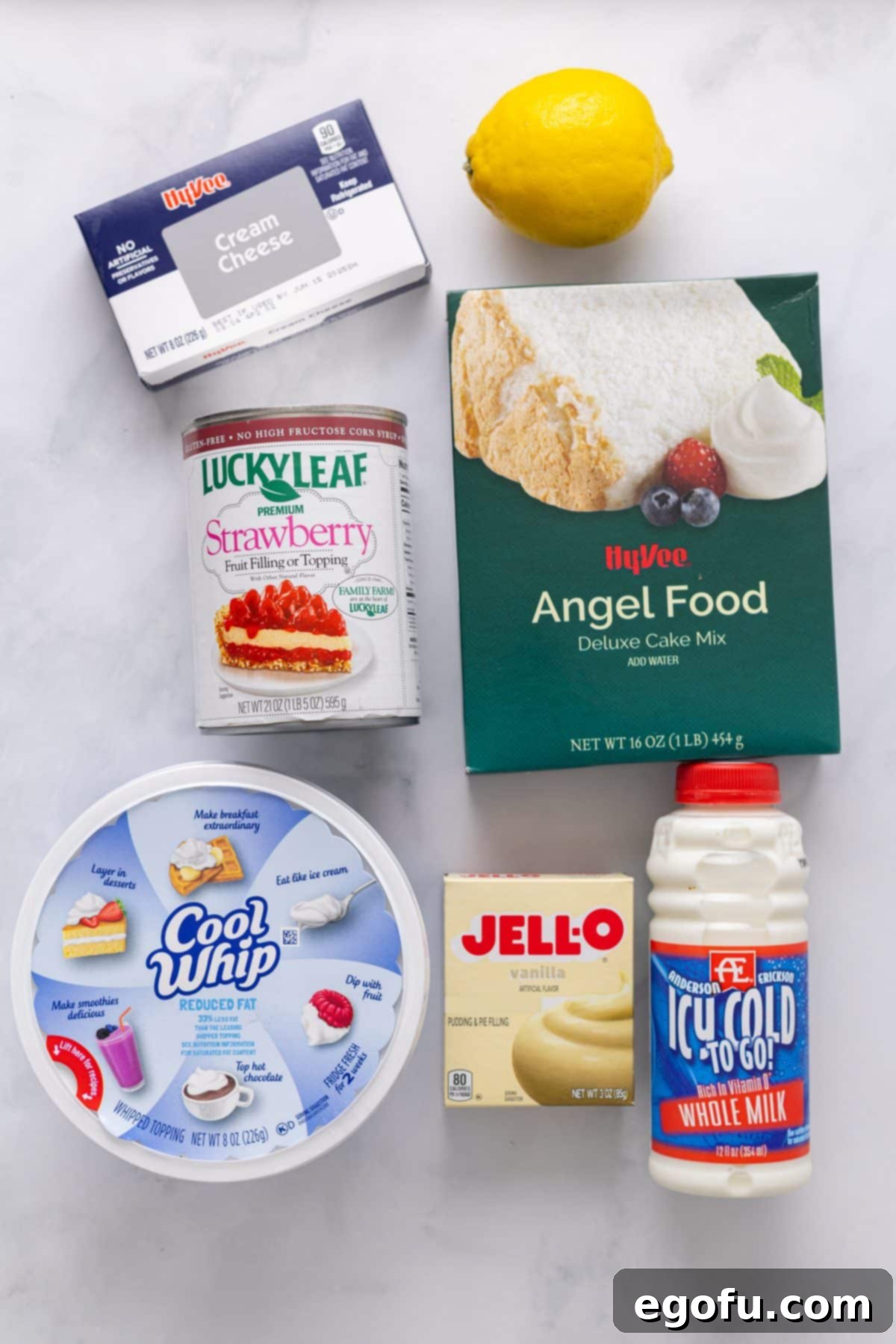 Cloud Nine Indulgence 5 Angel Food cake mix, lemon, cream cheese, strawberry pie filling, Cool Whip, vanilla pudding mix, and milk.