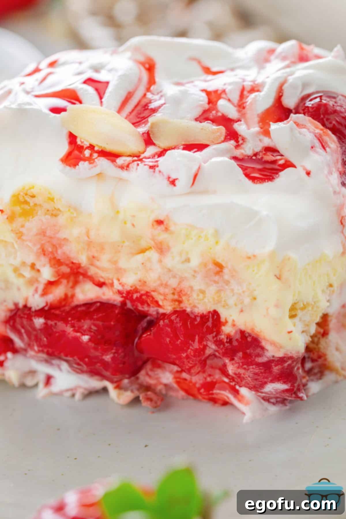 Cloud Nine Indulgence 8 A Heaven on Earth Cake with a slice removed to see the cake layers.