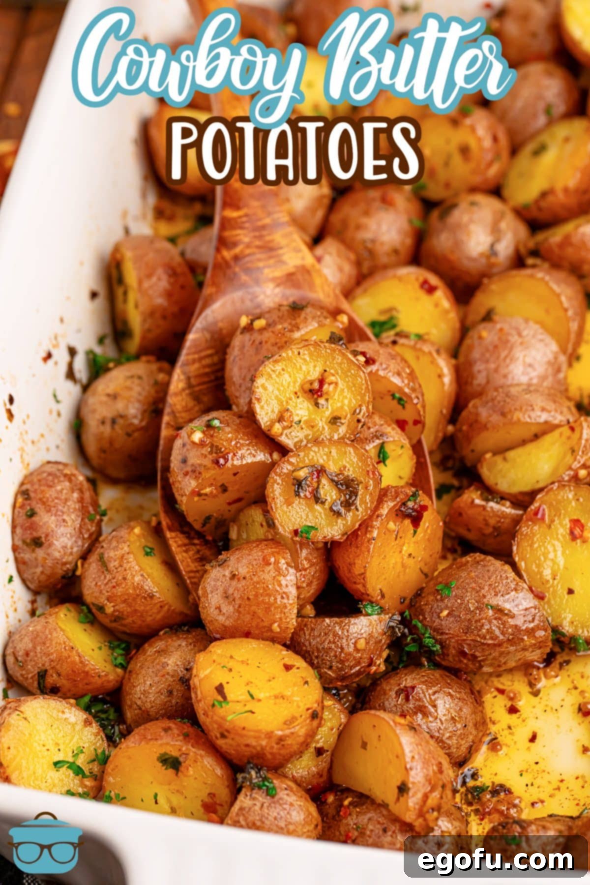 Spicy Garlic Herb Roasted Potatoes 4 A baking dish filled with beautifully roasted Cowboy Butter Potatoes, garnished with fresh herbs.