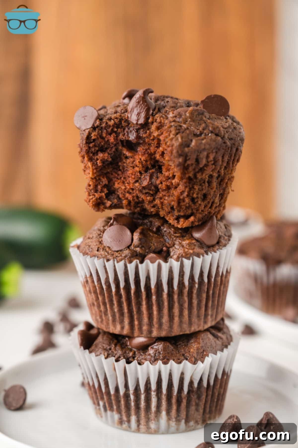Secretly Healthy Chocolate Zucchini Muffins 7 A small stack of Zucchini Chocolate Muffins.