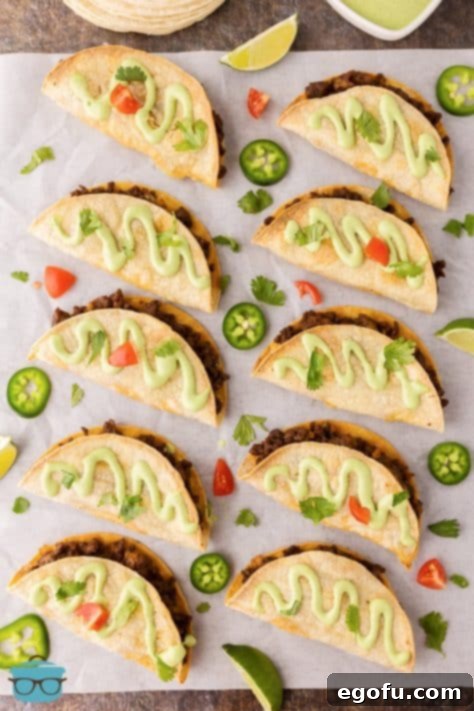 A piece of parchment paper with Baked Tacos.