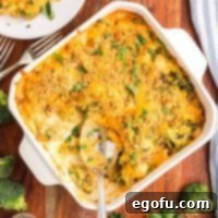 Looking down on a serving spoon getting another scoop of Chicken Divan.