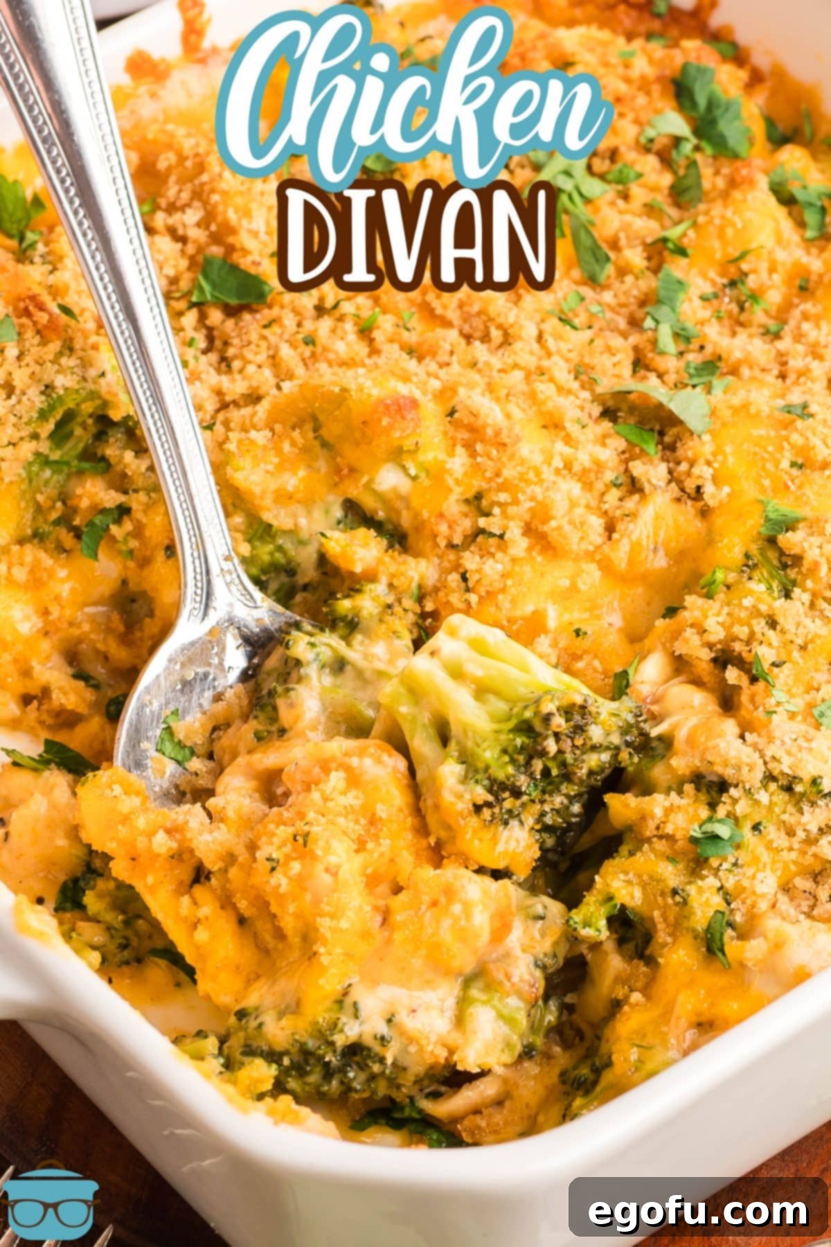 A spoon getting a scoop of Chicken Divan from the casserole dish.