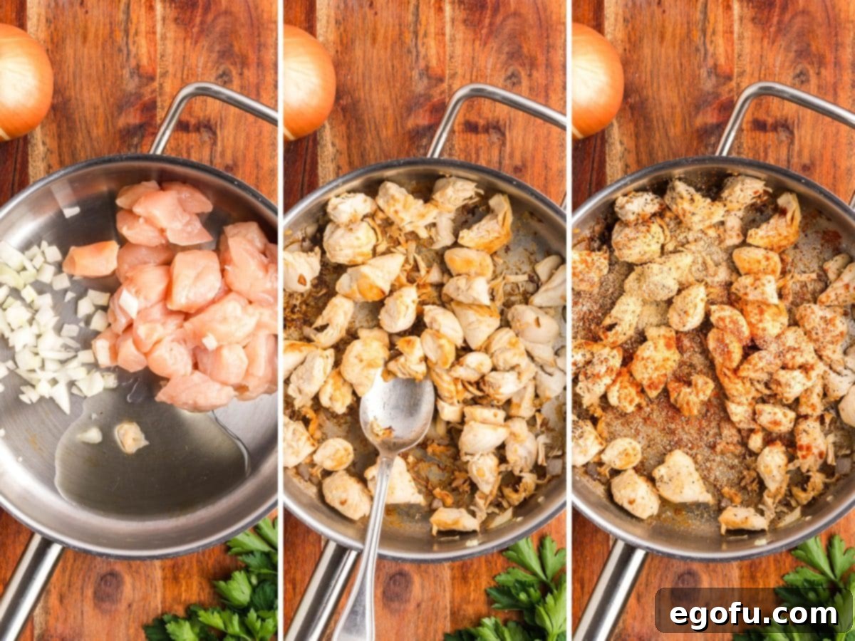 Chicken and onions being cooked in a pan with seasonings.