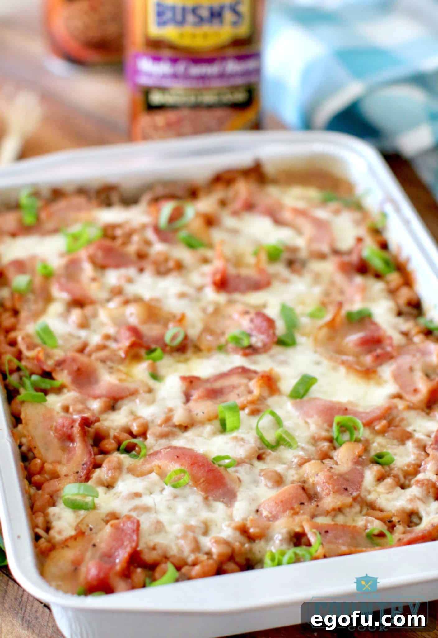 Close-up of the finished Beef and Bean Cowboy Casserole, topped with fresh sliced green onions, ready to be served.