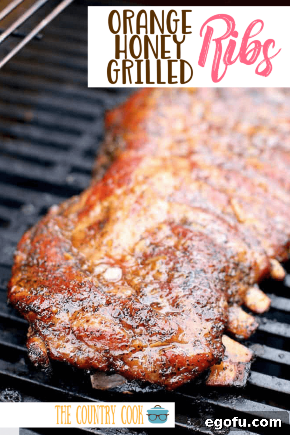 fully cooked grilled honey orange ribs shown on a gas grill.