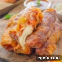 A small stack of copycat Disney World Pepperoni Pizza Spring Rolls.