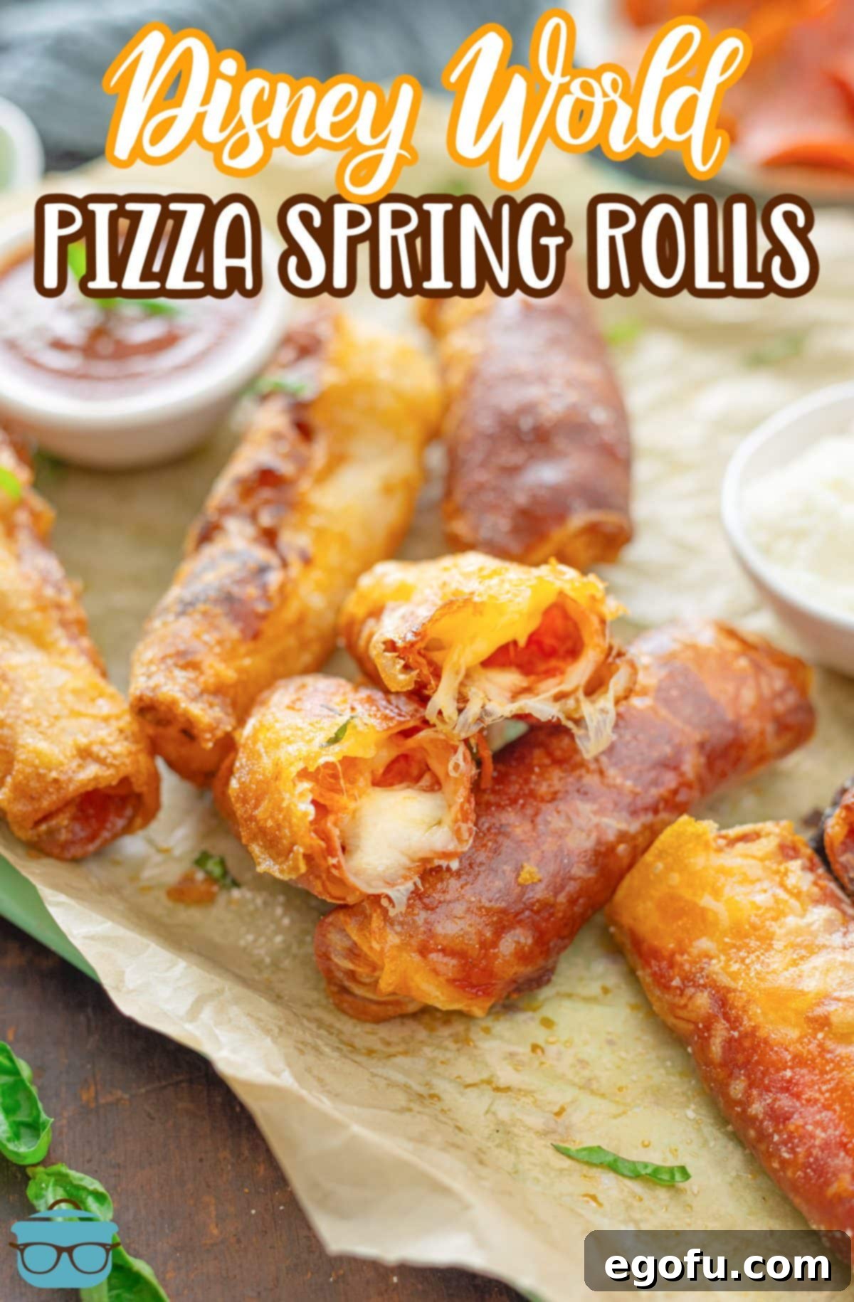 A few Disney World Pepperoni Spring Rolls, one cracked open to reveal the filling.