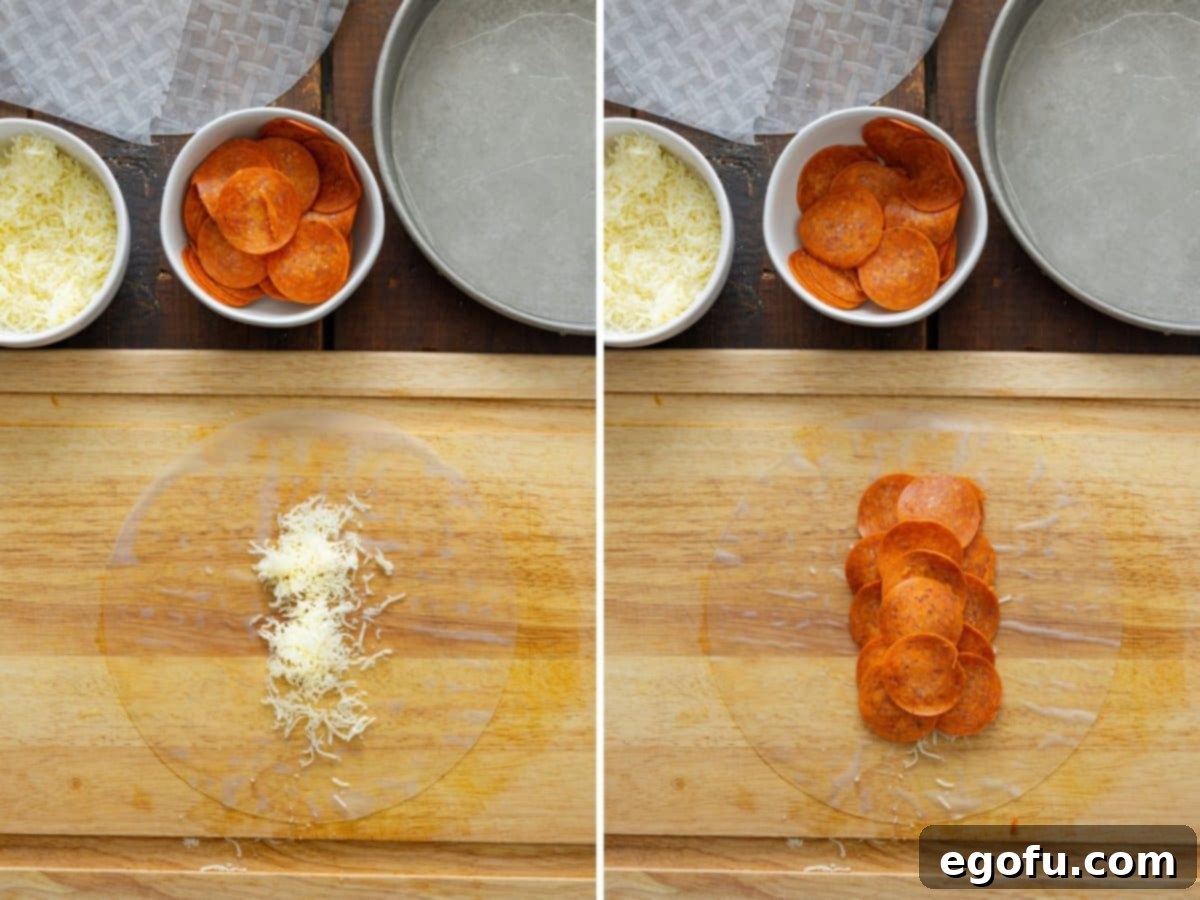 A spring roll wrapper with shredded cheese and pepperoni.