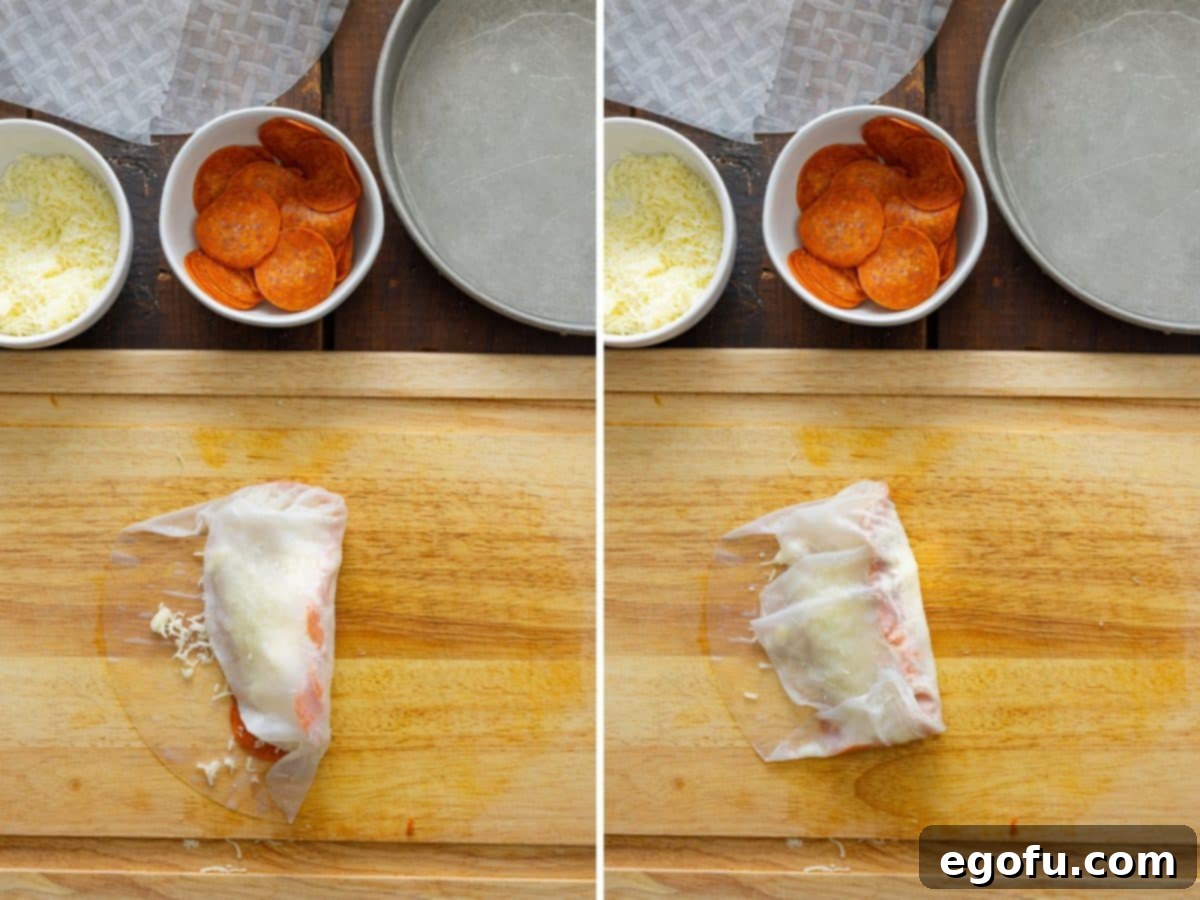 A spring roll being wrapped up.