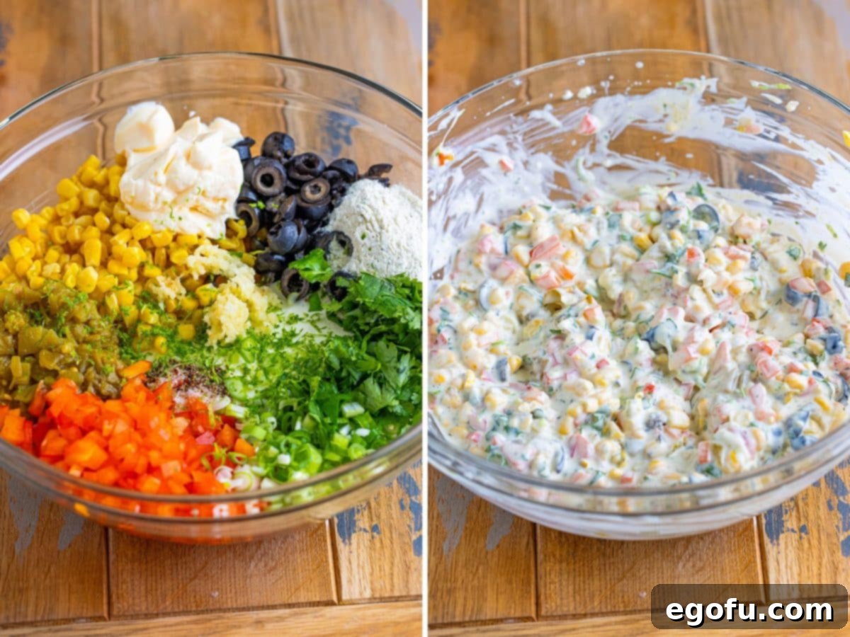 A close-up shot of a large glass bowl filled with all the vibrant ingredients for Poolside Dip, being gently mixed with a rubber spatula, showcasing the creamy base and colorful vegetables.