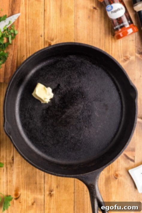 Smoky BBQ Chicken and Crispy Potato Skillet 14 Butter in a skillet.