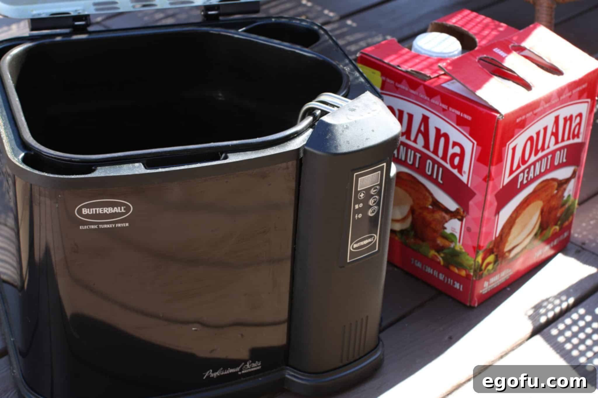 A Butterball Turkey Fryer with Lou Ana Peanut Oil shown sitting outside.