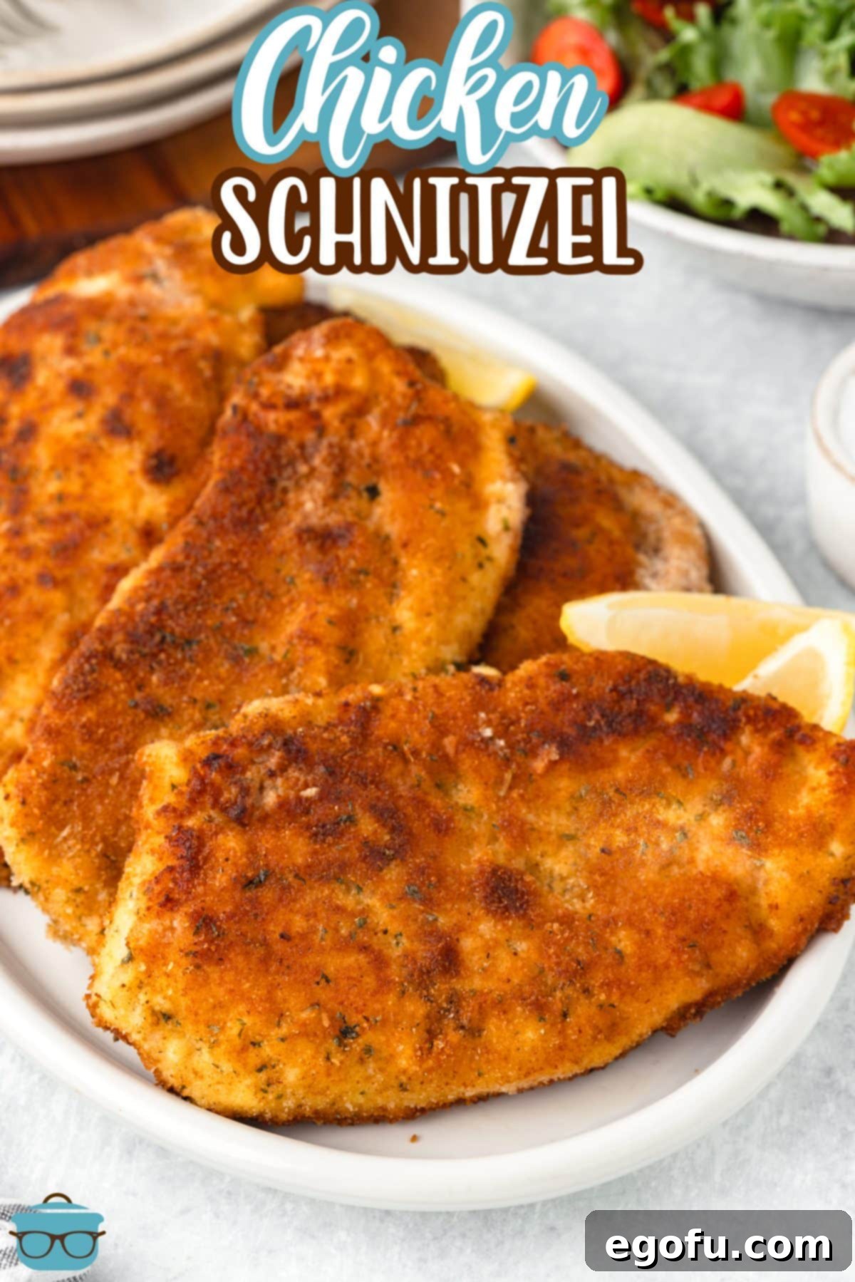 A serving platter full of Chicken Schnitzel.