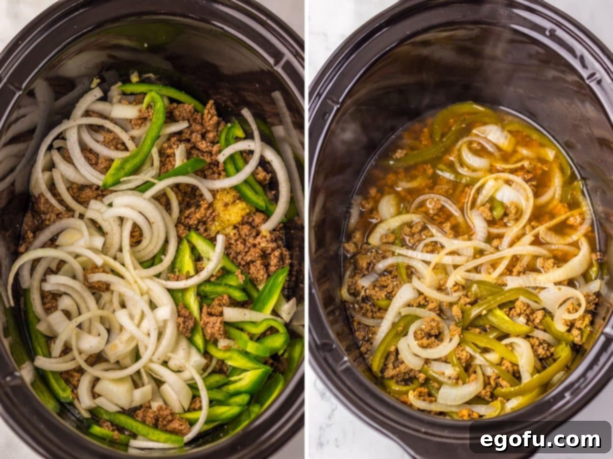 Onions, peppers and ground beef with beef stock and seasonings in a Slow Cooker.