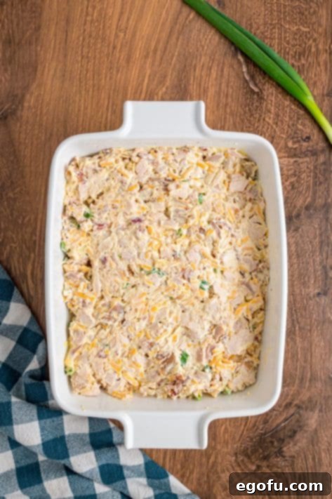 Casserole mixture spread out in a baking dish.