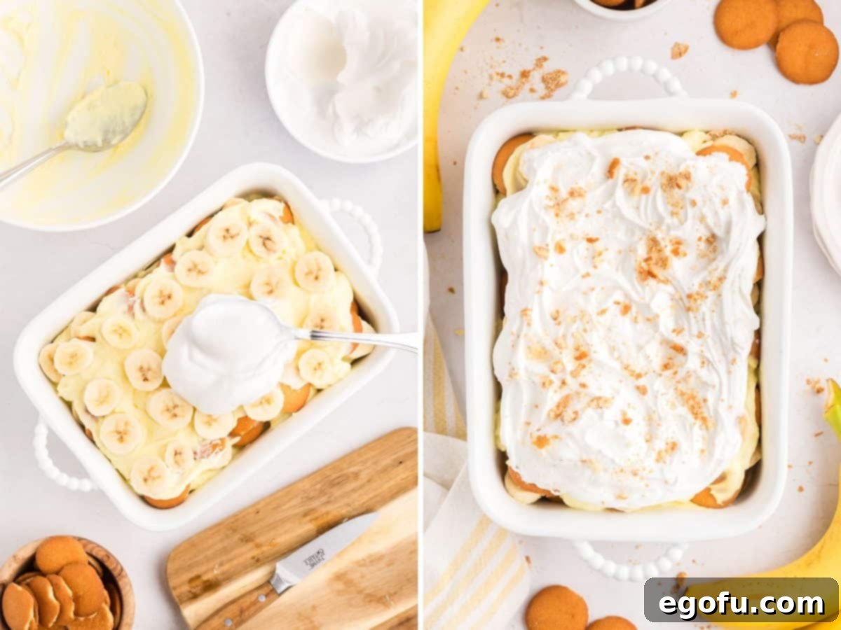 Thawed whipped topping being smoothly spread over the top layer of the no-bake banana pudding.