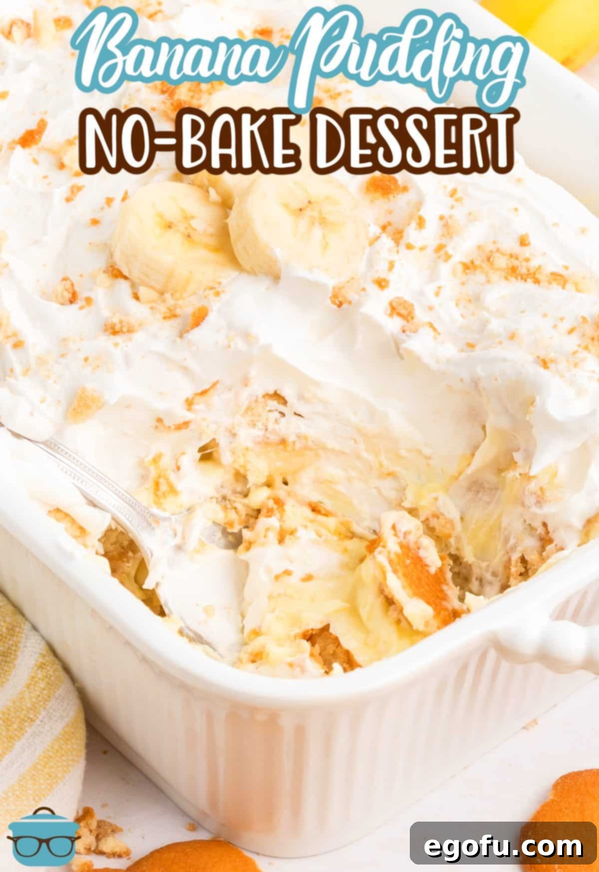 A baking dish filled with No-Bake Banana Pudding, with a portion scooped out, showcasing the delicious layers.