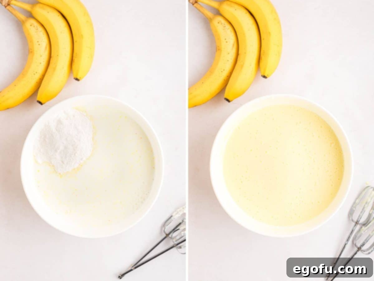 Instant banana pudding mix and whole milk being combined in a bowl with an electric hand mixer.