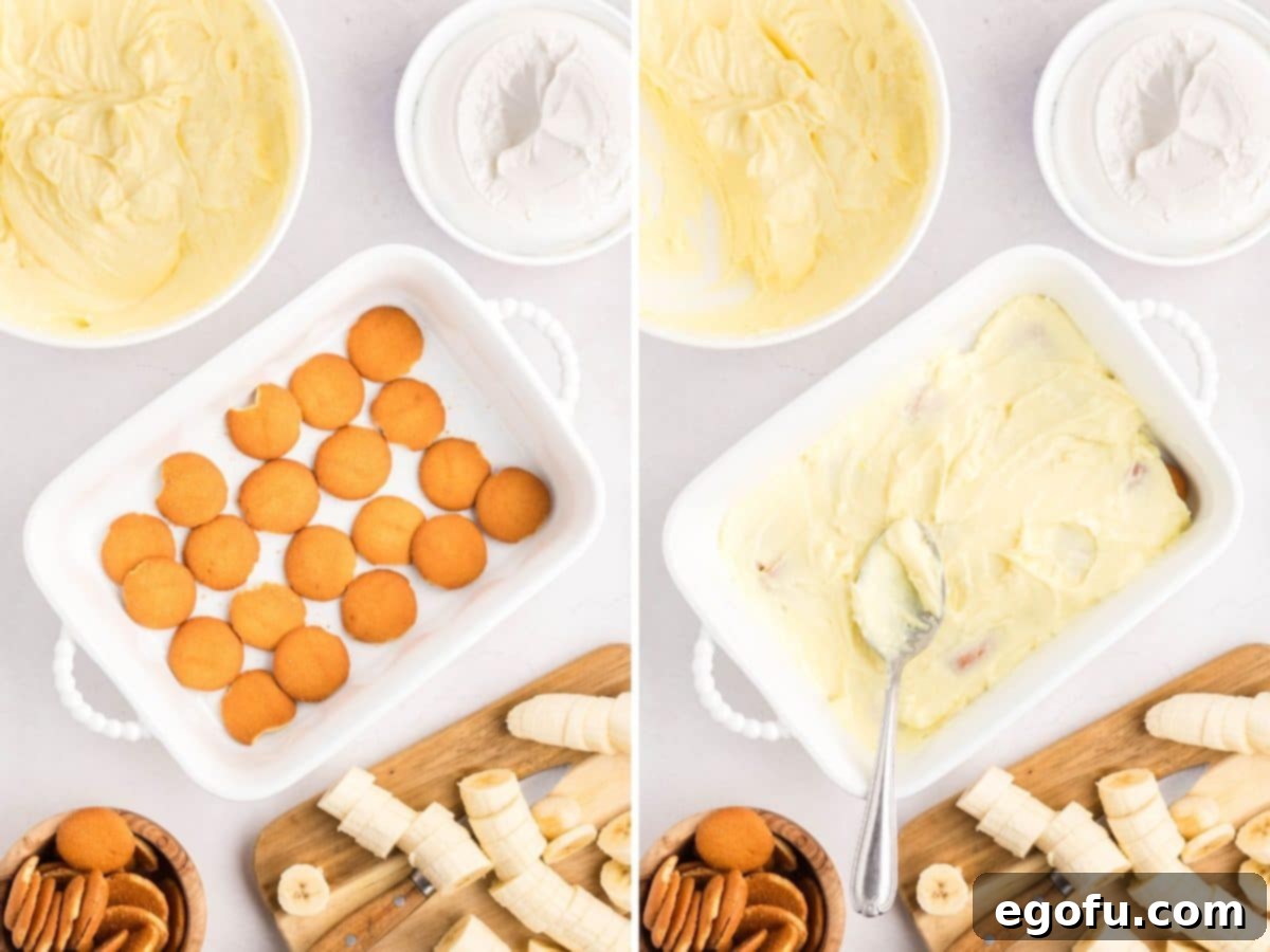 The first layer of Nilla wafers covered with a creamy banana pudding mixture in a baking dish.