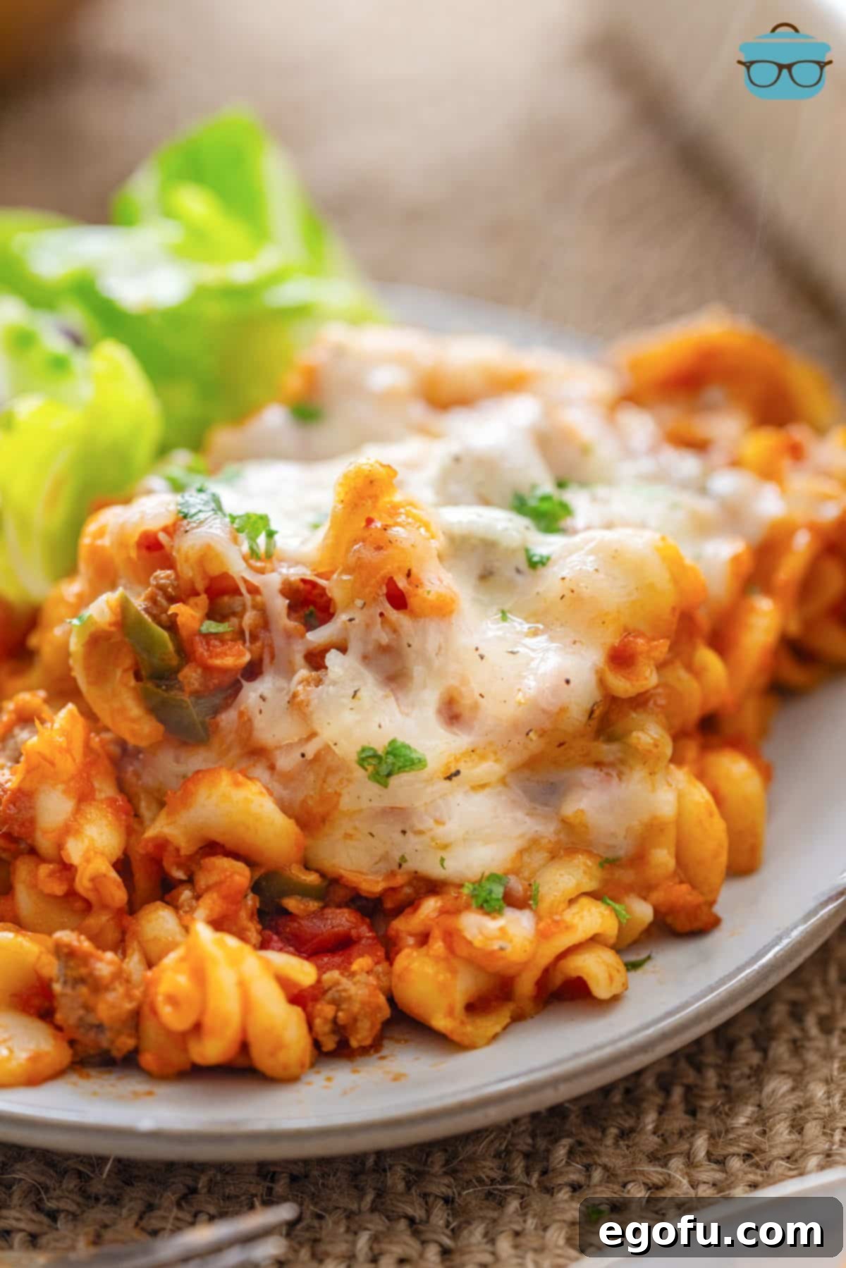 A generous serving of homemade Pizza Hut Cavatini alongside a fresh green salad, perfectly mimicking the classic buffet experience.